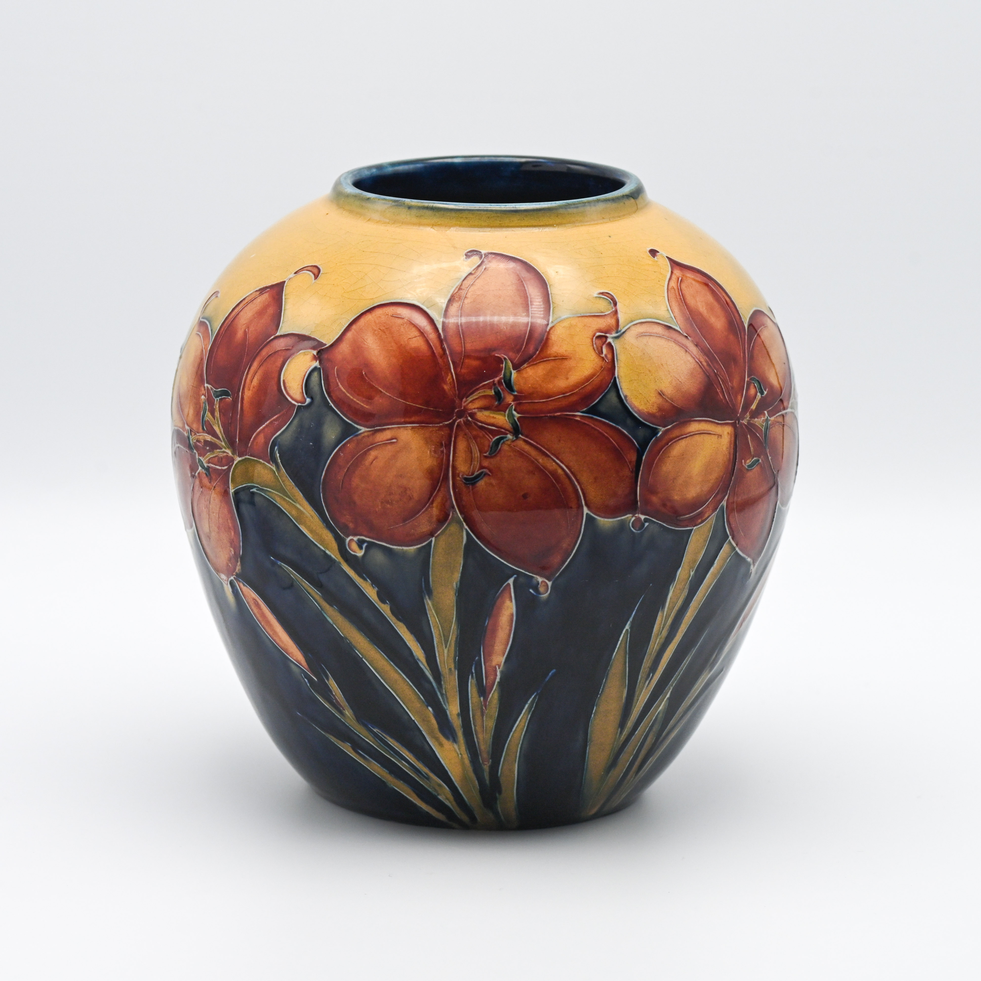 A Walter Moorcroft vase decorated with African Lily, circa 1953, 19cm height.