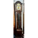A mahogany stained Tempus Fugit modern reproduction grandmother clock.