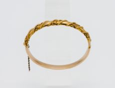 A 15ct yellow gold bangle decorated with leaf's in original box, approx. 11.4g.