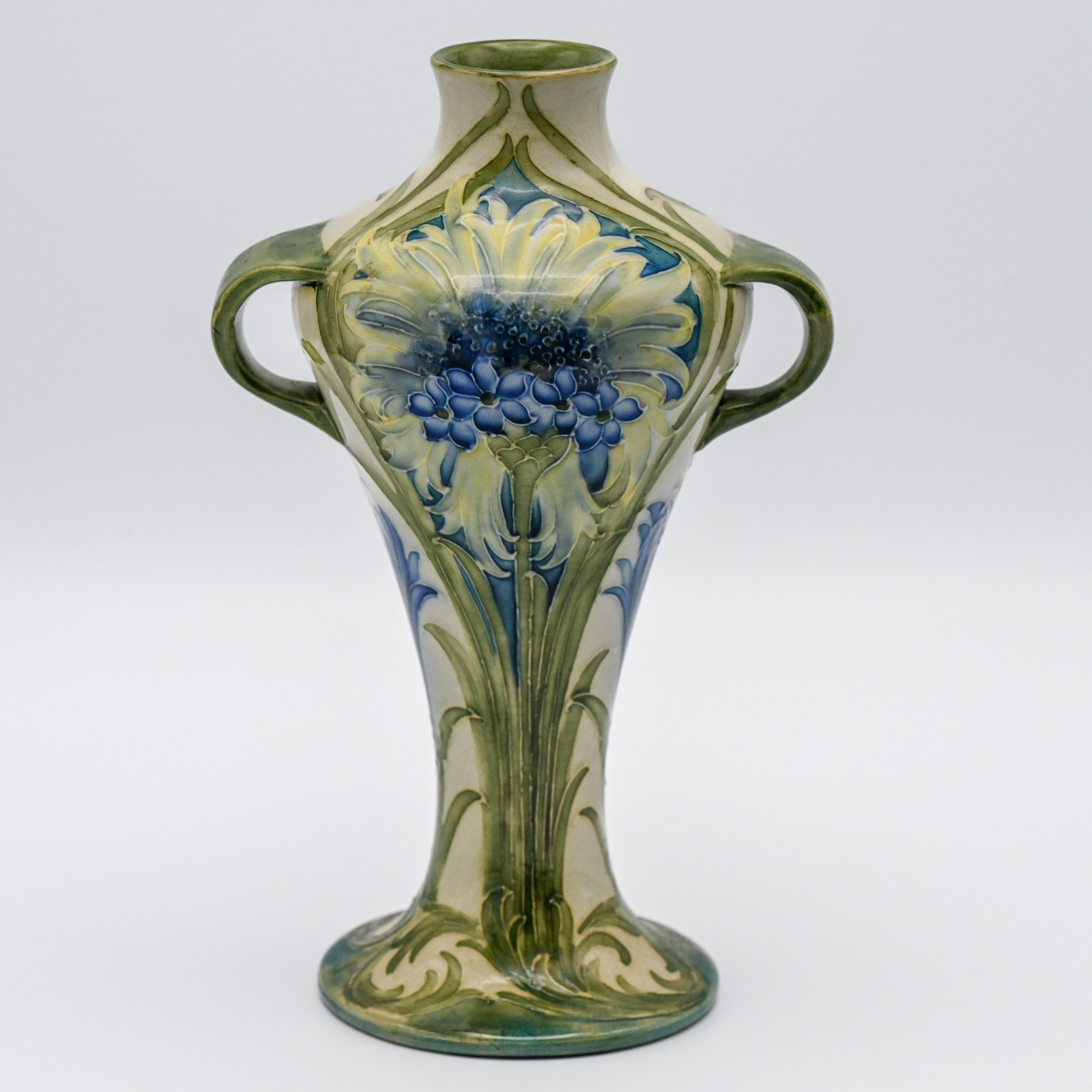 A William Moorcroft revived twin handled vase decorated with cornflowers, circa 1913, height 23cm.