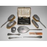 A five piece silver back dressing table set also silver back brush, glass jar and a silver