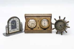 A small collection of three clocks including a small capstan style clock and a combination travel