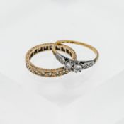 Two rings, 9ct gold, one with a full eternity of stones with diamond effect and one with two large