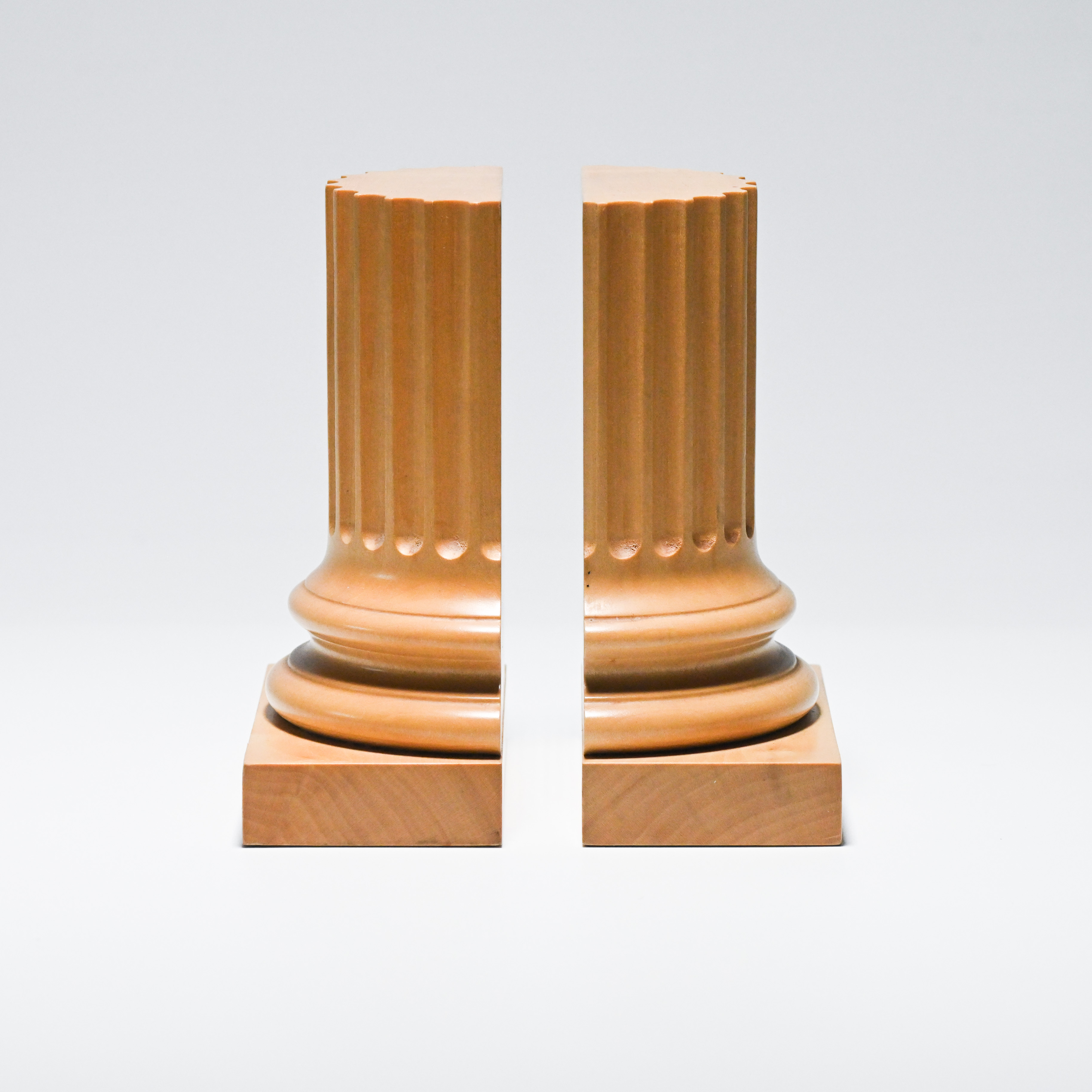 David Linley, a pair of sycamore bookends in the form of Roman columns, impressed signature,