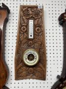 An oak carved cased two glass barometer Arts & Crafts style, 50cm x 23cm.
