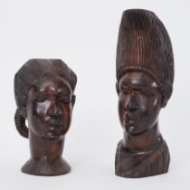 A pair of African carved heads from Nigeria, tallest 35cm.