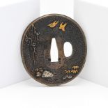 A Japanese Tsuba, Meiji era 19th/20th century Finely decorated in gold and silver inlay on each side