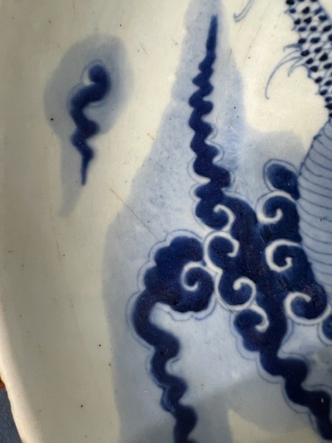 A Japanese blue and white bowl, freely painted with a dragon amongst flames and clouds, together - Image 25 of 30