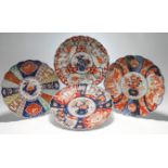 A group of four Japanese Imari plates, Meiji period and later, Each of lobed form and variously