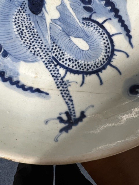 A Japanese blue and white bowl, freely painted with a dragon amongst flames and clouds, together - Image 24 of 30