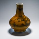 An Amber glazed Korean vase, late Joseon Dynasty, 19th century. The compressed globular body on a