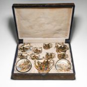 A Satsuma earthenware tea set, 20th century, each piece well painted with ladies sitting by
