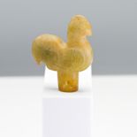 A carved jade finial, Ming dynasty (1368-1644) or earlier. Carved in the form of a cockerel, the