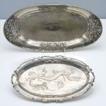 Two oval platters, 19th/20th century, one on four spherical feet