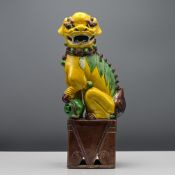A sancai ‘tile works’ model of a Buddhist Lion, Qing dynasty, 19th century Modelled crouching on a
