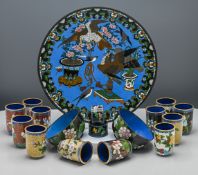 A Chinese cloisonné enamel plate, 20th century. Decorated with song birds and tethered birds of prey