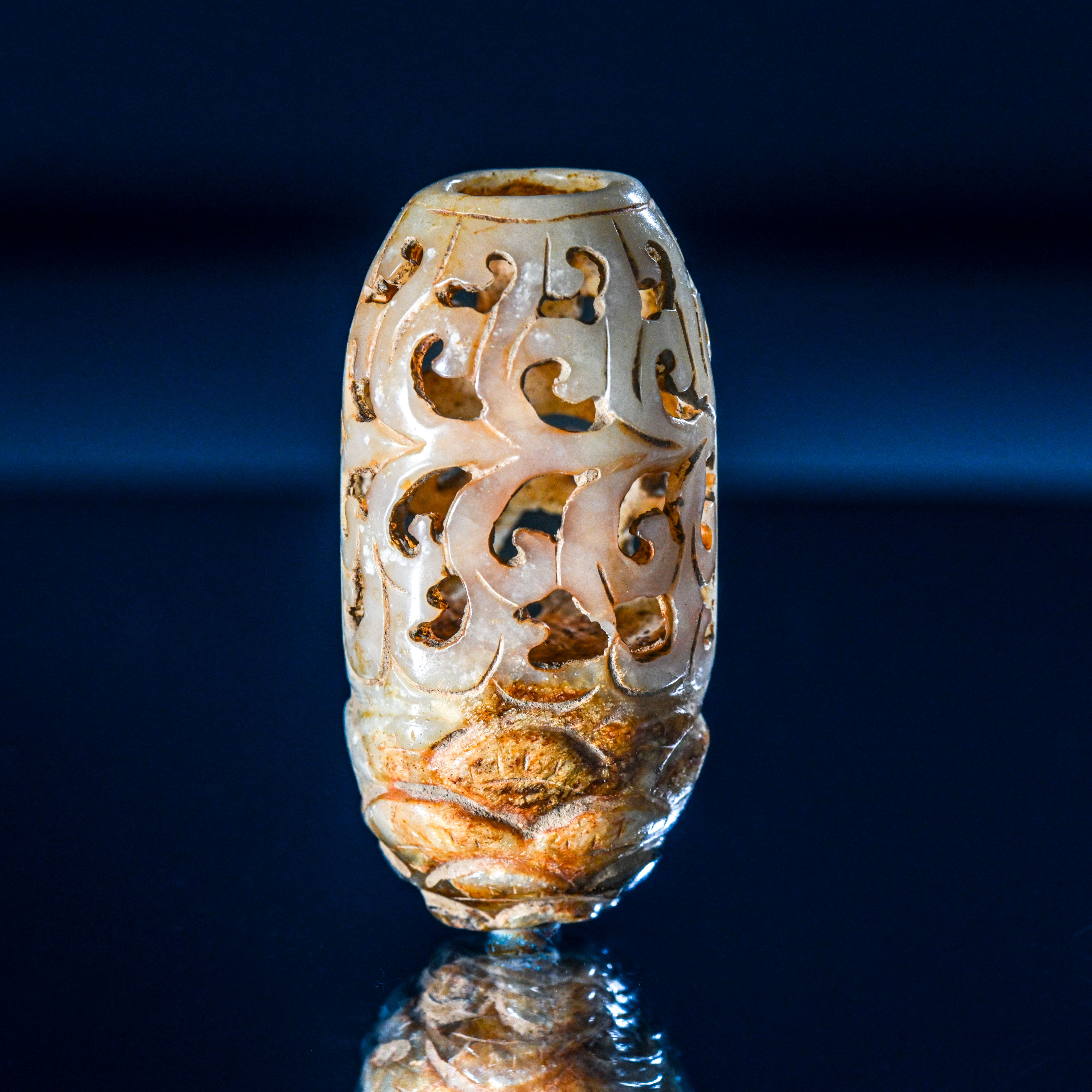 A carved jade cricket cage or finial, Ming dynasty or later. Carved in the shape of a pine kernel,