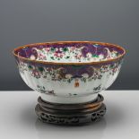 An unusual ‘famille-rose’ punch bowl, Qianlong (1736-1795), of lobed form, finely decorated under