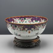 An unusual ‘famille-rose’ punch bowl, Qianlong (1736-1795), of lobed form, finely decorated under