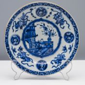 A blue and white plate, Qing dynasty, Kangxi (1662-1722) Painted with a central shaped medallion