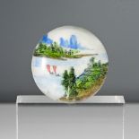 A Chinese White’ glass paperweight. Painted with two sailing boats in an estuary with mountains in