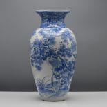 A Japanese blue and white baluster vase, freely painted around the sides with a crane amongst