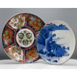 An Arita blue and white plate painted with a lake landscape, 31cm; together with an Imari Charger