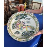 A massive 'rose-verte' charger, finely painted in the centre with a group of figures including