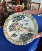 A massive 'rose-verte' charger, finely painted in the centre with a group of figures including