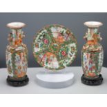 A pair of small Canton ‘famille-rose’ vases, circa 1900, each of baluster form and decorated