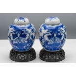 A pair of blue and white Kangxi style ginger jars and covers, 19th century, each of ovoid form and