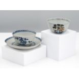 A Nanking Cargo blue and white tea bowl and saucer, 18th century. Each decorated with a pine tree