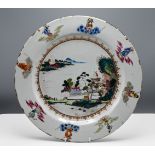 A "famille-rose," Charger, Qianlong," finely painted with pavilions in a lake landscape encircled by