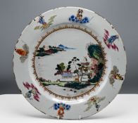 A "famille-rose," Charger, Qianlong," finely painted with pavilions in a lake landscape encircled by