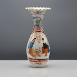 A Japanese Kutani vase, Meiji period or later, 20th century. The pear-shaped body rising to a