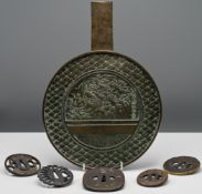 Five Japanese Tsuba, one inlaid in silver and gold with ducks flying over reeds, 6.5cm to 8.5cm;