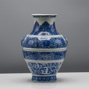 A Ming style blue and white jar ‘Hu’, 19th/20th century. The ovoid body painted with bands of waves,