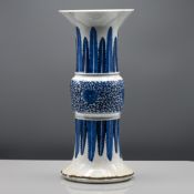 A blue and white beaker vase, 19th century, heavily potted with the central knop decorated with