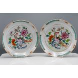 A pair of "famille-rose" Saucer Dishes, 'Qianlong,' each decorated in the centre with a phoenix