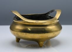 A bronze tripod censer, Qing dynasty (1644-1912) or later, The compressed globular body