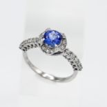 An 18ct white gold diamond and tanzanite ring, by Lavill, diamond shoulders, size T.