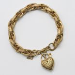 A fancy 9ct bracelet, twisted engraved curb, open ebonised heart padlock, 19.6g.