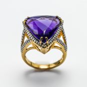 An impressive 18ct yellow gold diamond and amethyst ring, size N.