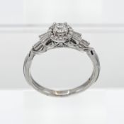 An 18ct white gold ring set with 1/2ct of diamonds, size P.