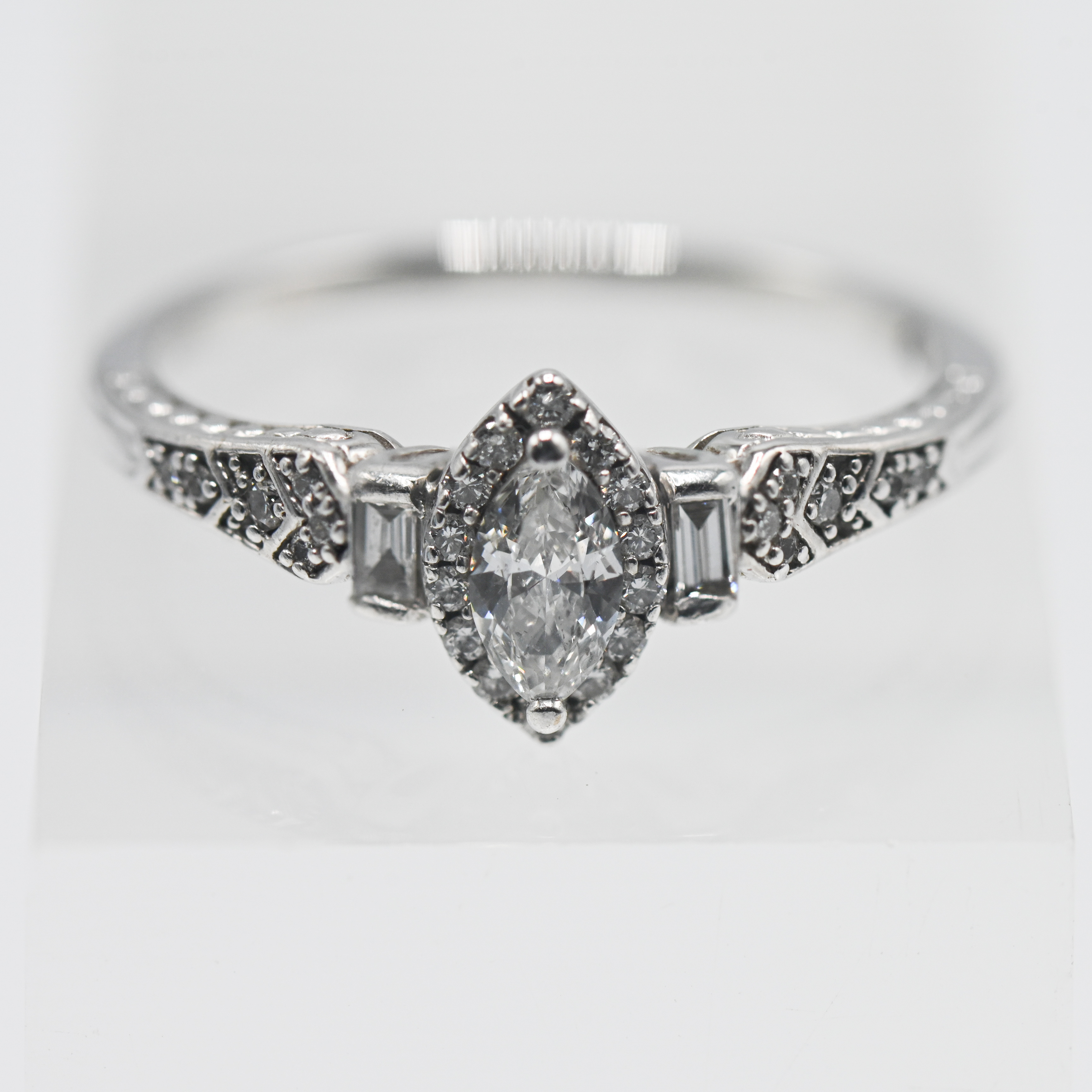 An 18ct white gold diamond marquise ring, stamped 0.50 ct total weight, size S.