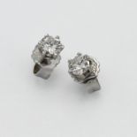 A pair of diamond studs approx. 0.20ct on 14ct white gold butterfly clasps.
