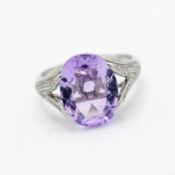 An 18ct white gold amethyst and diamond ring, size L.