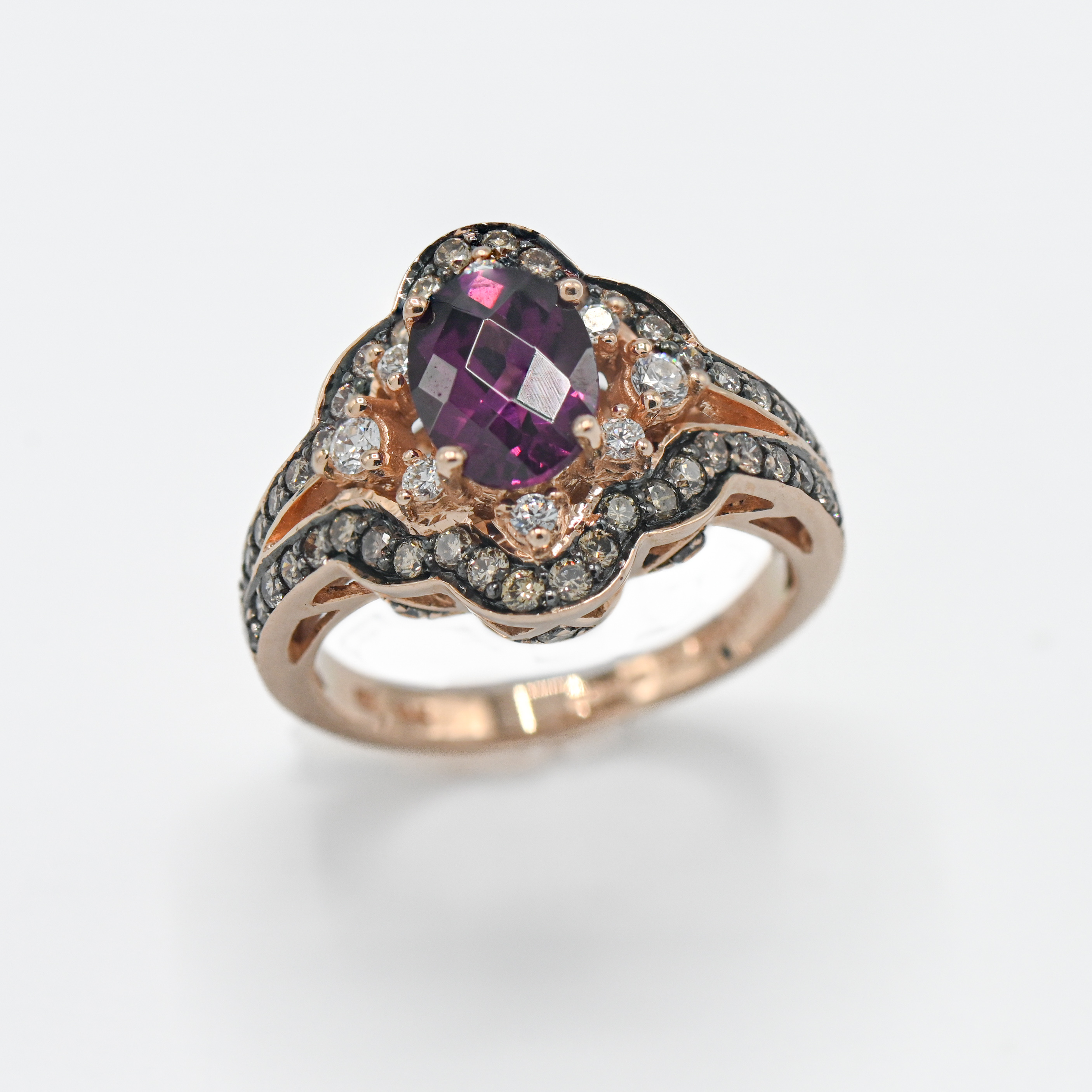 An 14ct (.585.) rose gold Amethyst and diamond ring, reproduction made by 'Levian' , size K.