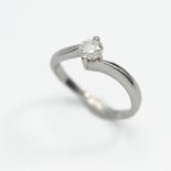 A platinum and diamond cross over ring, size M, approx. 0.50ct with original purchase receipt by
