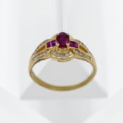 An 18ct yellow gold ruby and diamond cluster inner channel ring, size T.